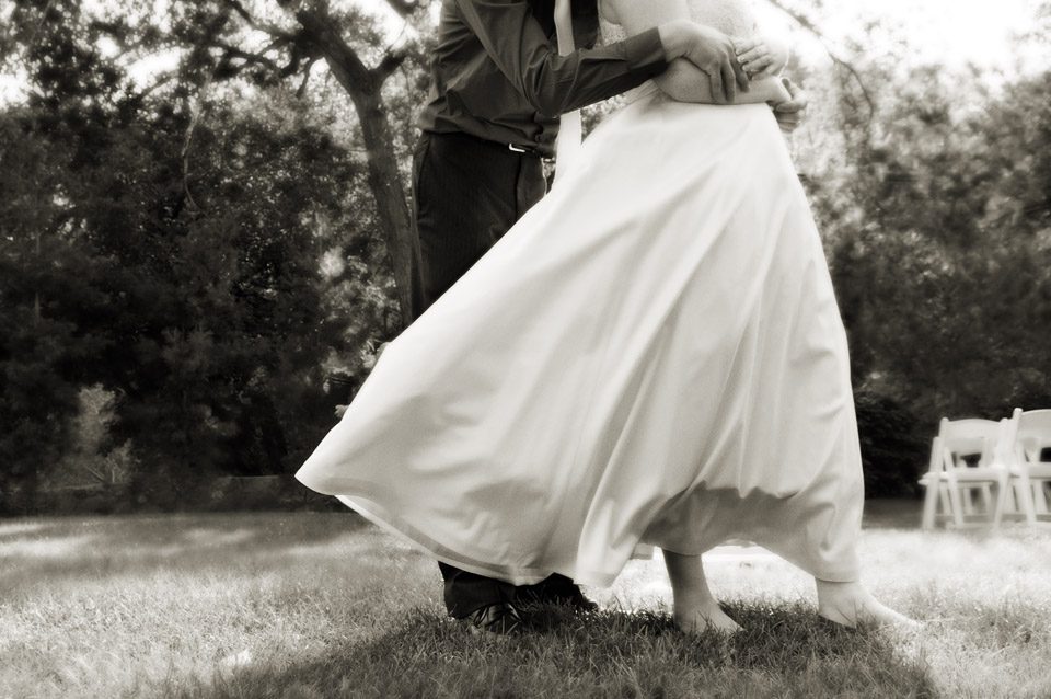 Blowing dress in B&W wedding photo