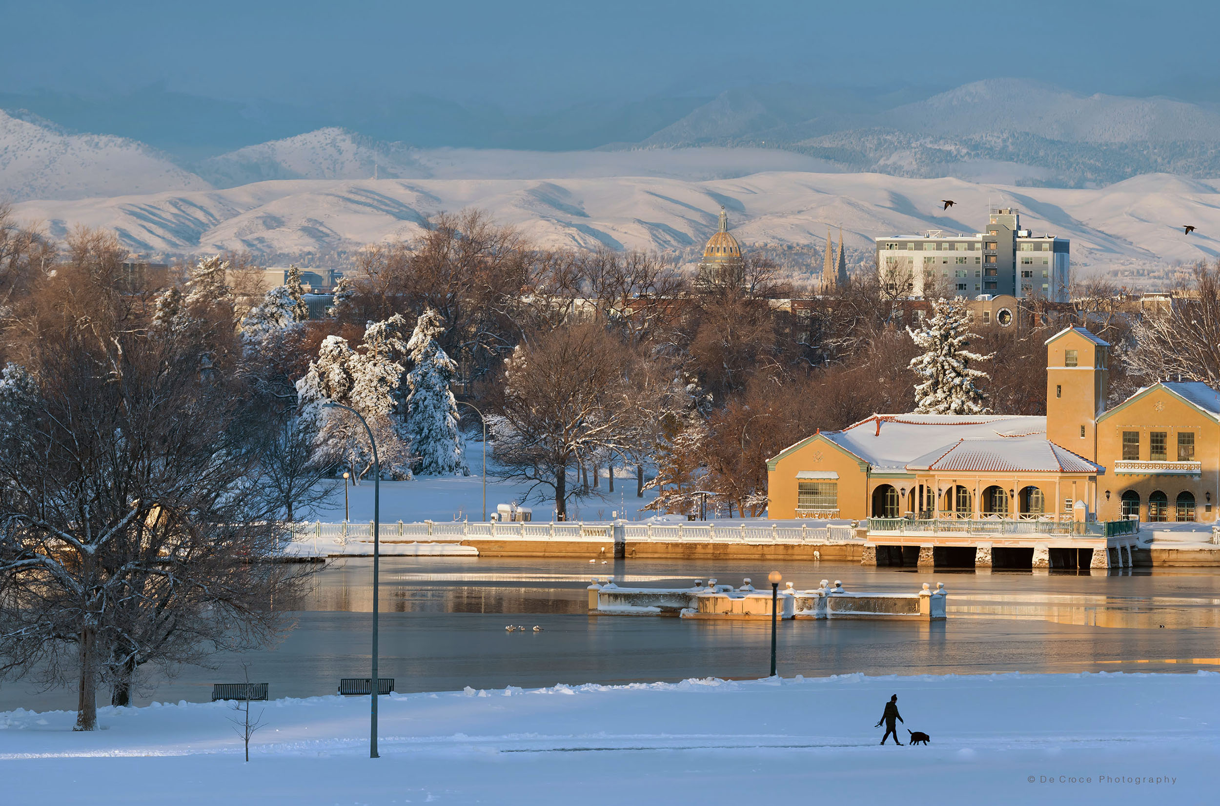 Denver Colorado snow scene capitol building and park walker in snow.