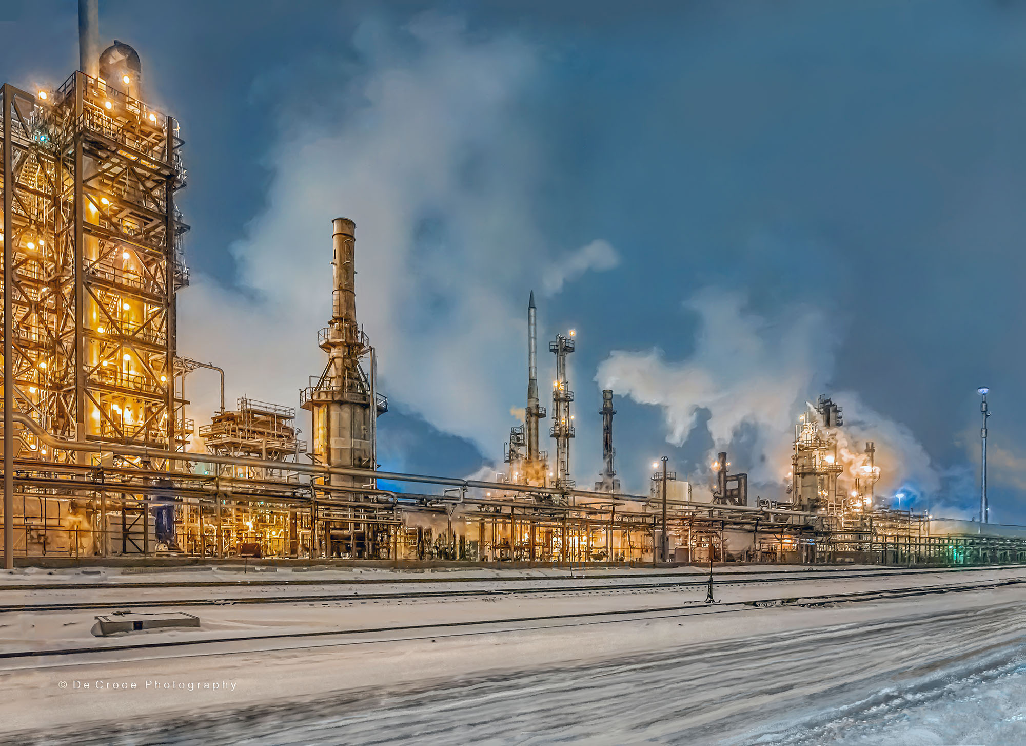 Denver industrial photography night shot depicting oil refinery in mid winter