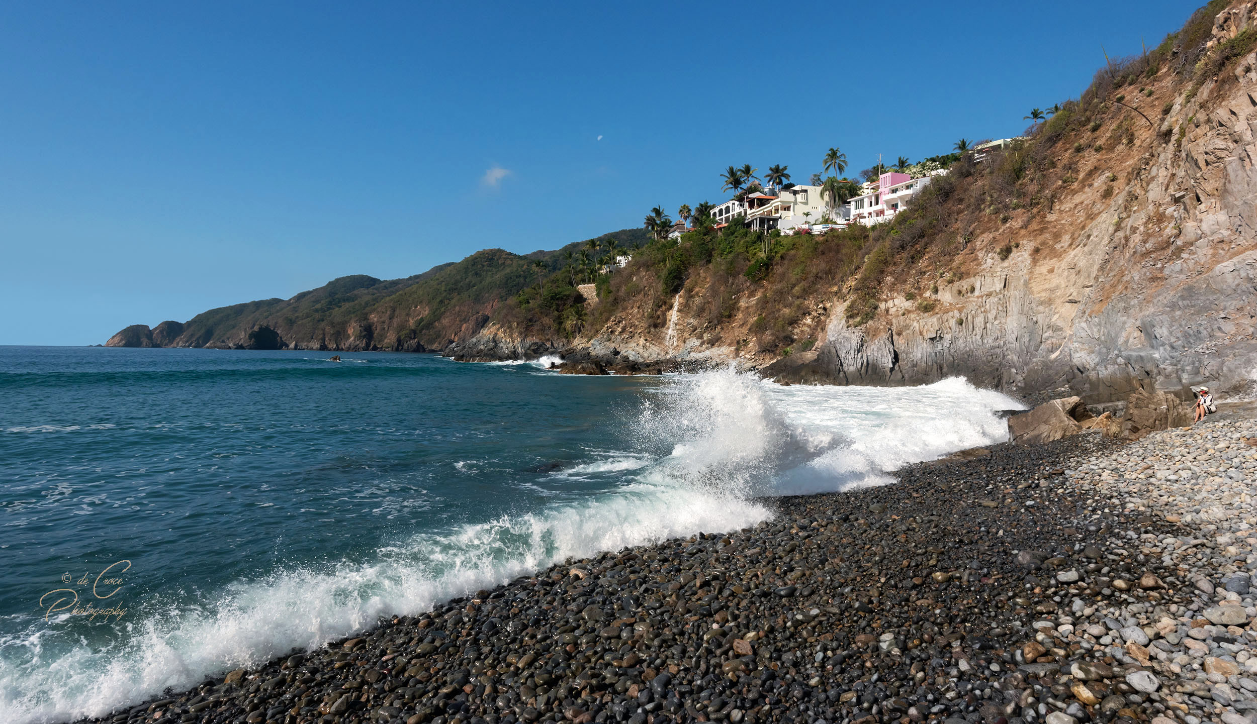 Tropical resort beach photography shows rugged shorline of Vida Del Mar in Colima Mexico.