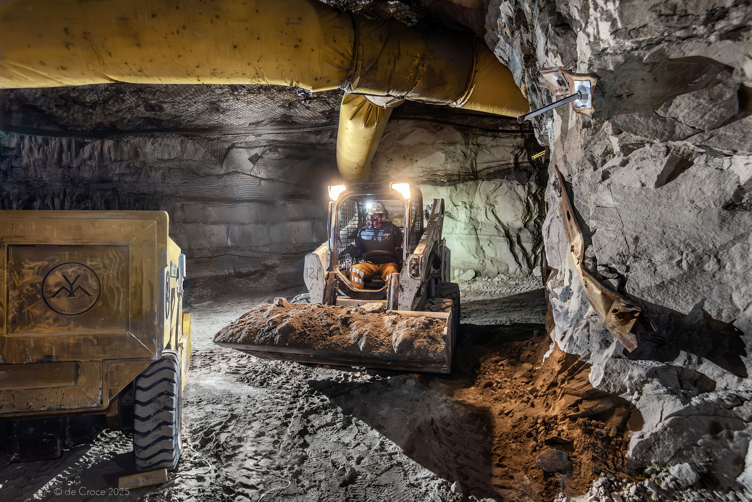 Commercial mining photographer depicts load-haul-dump operations in underground mine