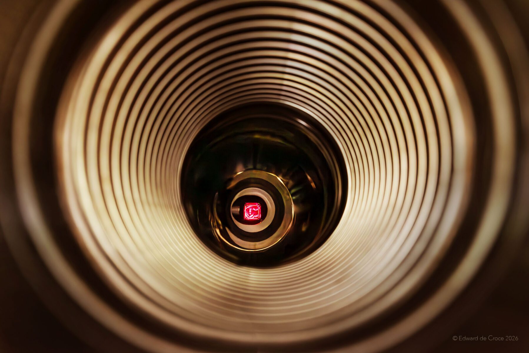 Denver commercial photographer shoots inside nuclear fusion laser at Xcimer Energy. The image shows the laser source in red.